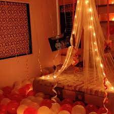We love the adaptation on this escort wall, which reads: It Was Their First Night After Wedding And Decorated Their Room Curtain Flowers Din Lights And Candles Had Their Own Charm In The Me Room Decor Home Decor