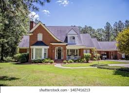 Red brick georgian colonial style house with three dormers and attached garage. Large Red Brick Traditional Colonial Home Stock Photo Edit Now 1407416213