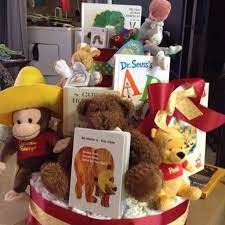 Not Diaper Cake But Use Stuffed Animal Book Decorations For Mantle End Tables Etc Book Baby Shower Theme Storybook Baby Shower Baby Shower Book
