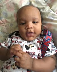 My chunky monster wearing a size 3 diaper and 6-9 month cl…