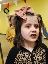 Bows in toddler's hair, still growing out