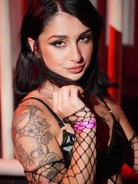 Everybody's looking at me But that's alright, I like attention The clubs  not hot, until I walk through They stop and stare and watch me move