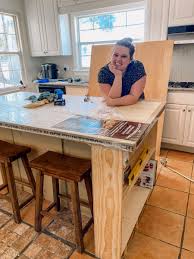 My contractor added steel beams on the top to support the overhang for seating. Diy Kitchen Island Free Easy Instructions To Make Yours Look High End