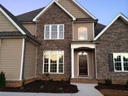 On the top gables are cedar impressions double 7 perfection shingles in natural clay. Almond Joy It S Move In Week Brick House Siding Craftsman House Exterior House Colors