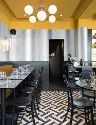 Black And White Restaurant Interior This Is Contrast Because Of The Dark Black Furniture Against The White Accented Wall And Restaurant Interior Design Modern Interior Design Restaurant Interior