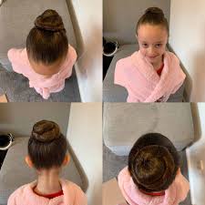 Two simple braids crossed over and followed by two ponytails. Best Hairstyles For Dancers Uk 2021 Guide
