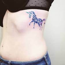 Geometric Watercolor Tattoo Of A Unicorn Inked On The Left Rib Cage Unicorn Tattoos Tattoo Designs Tattoos