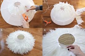 Homemade sculptural paper orb pendant lights: Diy Feather Pendant A Beautiful Mess