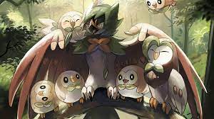 Download Rowlet Protected By Decidueye Wallpaper | Wallpapers.com