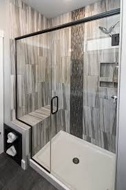 You can choose the one for you based on the bathroom's layout as well as the available free space. Shower Walls Asturia 12 X 24 Azul Accent Titan Interlocking Mosaic Glass Shower Enclosure Dark Tile Shower Gray Shower Tile Bathroom Shower Design