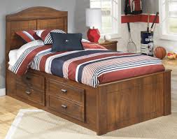Signature Design By Ashley Barchan Medium Brown Twin Panel Bed With Underbed Storage B228 50 B228 52 B228 53 B100 11 Goedekers Com Bookcase Bed Twin Storage Bed Bed With Underbed