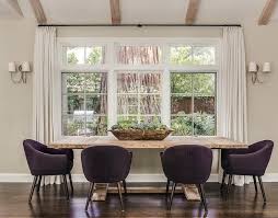 Chic Dining Room Boasts A Salvaged Wood Dining Table Pushed Against A Wall With Windows Dining Table In Living Room Chic Dining Room Traditional Dining Rooms