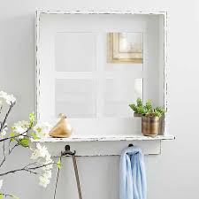 Our curated collection of unusual and unique mirrors, decorative glasses and contemporary styles will suit any room beautifully. Distressed White Windowpane Mirror With Hooks Kirklands