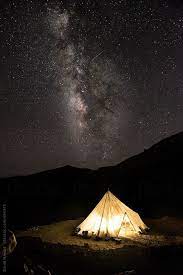 Sitting around camp fire smiling Night View Of Milky Way And One Of The Tea Tents You Can Find Before And After Some Of The Higher Passes During T Aesthetic Travel Pictures Tent Night Camping