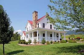 We were able to have the venue for the entire day, with full use of the grounds for pictures and the bridal cottage for getting ready. Classic Farmhouse Proportions With Wraparound Front Porch And Rock Chimney This Red Metal Roof Home Farm Style House Farmhouse Style House Farmhouse Exterior