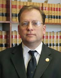 Former Wasco DA gets settlement