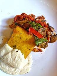 Pour some polenta in a deep plate, top with a few tablespoons of mushroom sauce. Vegan Disney Food Review Mama Melrose S In Disney S Hollywood Studios