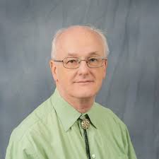 How does the English name Ray, originating from Raymond, end in  pronunciation: in a vowel or in a consonant? That's what its Hungarian  declination depends on.