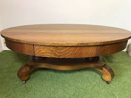 All wood oak coffee table with center drawer, perfect size, 24 wide x 48 long x 16 high. Vintage Tiger Oak Oval Coffee Table With Long Drawer And Casters 44w X 27d X 16 5h