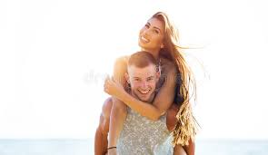 Couple carrying christmas tree together. 828 Boyfriend Carrying Girlfriend Beach Photos Free Royalty Free Stock Photos From Dreamstime