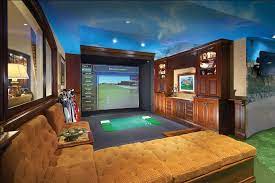 Golf Simulators Are Popular In Homes Built For High End Clients By Dugally Oberfeld Golf Room Golf Simulators Golf Simulator Room