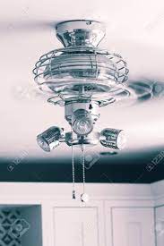 Ceiling fans often come with a mounting flange beneath the fan motor that can accommodate an optional light kit. Ceiling Fan Light Fitting With Blades Spinning In A Kitchen Stock Photo Picture And Royalty Free Image Image 142736317