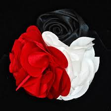 Putting flowers in your hair is a timeless look that is elegant and unique. Silk Flower Pin Hair Clip With Black Red White Flowers Quiet West