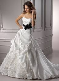 Check spelling or type a new query. The Bridal Gown With Black Floral Sash Is Featured By Pick Ups And Flowers Brautmode Braut Hochzeitskleid