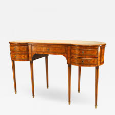 It has solid oak drawers with dovetails at the front and back. French Louis Xvi Satinwood Kidney Desk