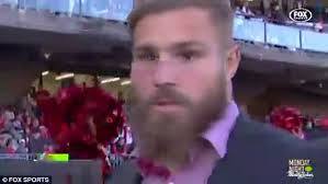 NRL player Jack De Belin stares at cheerleaders