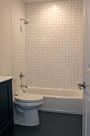 For a peaceful bathroom retreat that also satisfies the color fan, a glossy, bright blue subway tile mimics the feel of a caribbean ocean without being kitschy. Bathroom With Herringbone Pattern White Subway Tile Surround And Black Hexagon Tile Flo Patterned Bathroom Tiles Japanese Bathroom Design Bathroom Tile Designs