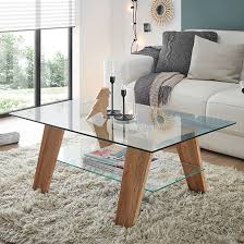 From modern style, glass top coffee tables to more traditional wooden tables, value city will have the right table to add personality to any room. Lublin Clear Glass Coffee Table With Oak Wooden Legs Sale