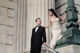 For a more formal affair, consider black or burgundy bridesmaid dresses. Outdoor Architectural Wedding Portrait Bride In Floral Champagne Strapless Mermaid Wedding Dress Groom In Black Tuxedo Downtown Tampa Hotel Accommodations Le Meridien Marry Me Tampa Bay Most Trusted Wedding