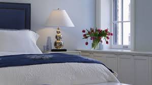 Chad mellon inspiration for a coastal bedroom remodel in los angeles with white walls light switch by bed for lamps. Blue Bedroom Decorating Tips And Photos