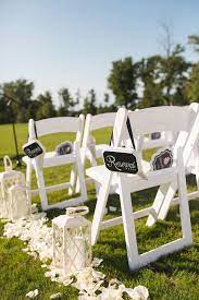24 x white padded wedding chairs. White Chairs And Aisle Decorations