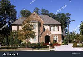This two story modern style house design can be used for sloping lot as shown below. A Nice Brick And Stucco House With A Two Story Bay Window Stucco Homes Bay Window Exterior Front Doors With Windows