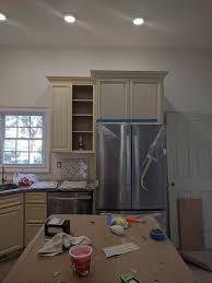 If you have these and your door won't close or stay closed, loosen the screws to slide the catch forward or backward on the cabinet frame. Cabinet Above Fridge Doesn T Open