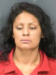 Woman charged with kicking, head-butting, spitting