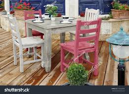 white wooden dining table chairs
