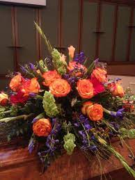 Order celebration of life casket spray sympathy from orchid flower shop, your local mississauga florist. Casket Spray Orange Blue Red Funeral Flower Arrangements Cemetery Flowers Memorial Flowers