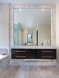 In this bathroom designed by arent & pyke, the simple bronze frame of the mirror highlights the other shimmery details throughout, and pops against the dark gray grooved drawers and black sconces. 10 Best Ideas Of Bathroom Square Mirrors To Enhance Bathroom Decor Beautyharmonylife