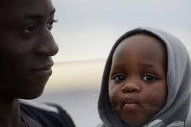 This is the face of the one-year-old baby who has been left stranded at sea  for 19 days. She is one of 49 persons. Winter is here. A storm is  gathering. Let