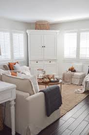 This petite living room features minimal décor set against a solid white backdrop, transforming cramped into cozy. Cozy White Cottage Fall Home Tour Fox Hollow Cottage