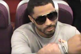 Moment police board plane and arrest 'barbaric' pair who poured boiling  water over elderly couple