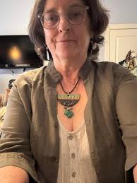 I have been getting back into creating jewelry. I had to start making  necklaces in colors I don't wear so I would not keep them. This one I call  classy green and