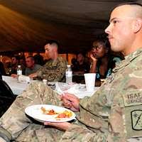 U.S. Marine Corps Master Sgt. Luis Guardado, left,