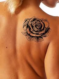 This Unique Rose Tattoo Appears To Be Made Out Of Us Currency Traditionally A Rose Tattoo Symbolizes Hope Love Promise And Neck Tattoo Tattoos Money Tattoo