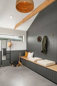 This rustic living space has multi colored tile flooring and large logs cut in half used for the exposed beam look on the ceiling. Photo 11 Of 11 In The 12th St Abode By Webuild Residential Dwell