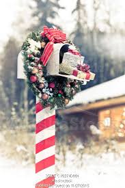 Photo Of Mailbox Decorated For Christmas With Wreath And Candy Cane Striped Post In Front Of Christmas Mailbox Decorations Mailbox Decor Christmas Decorations