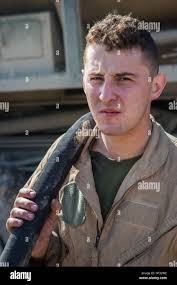 U.S. Marine Corps Devon Anthony, a crew member assigned to Marine Heavy  Helicopter Squadron (HMH) 464 supports a fuel hose